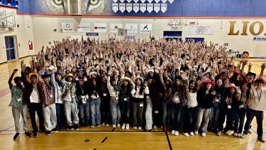 Group photo of BCSLC attendees in the gymnasium.