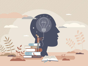 photo with a face silhouette and books stacked