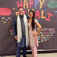 Two staff dressed in traditional attire to celebrate Diwali